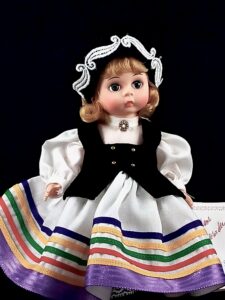 Madame Alexander doll in white dress