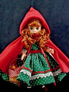 Madame Alexander Red Riding Hood doll in green dress and red cape