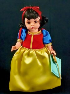 Madame Alexander Snow White doll in Yellow, red and blue dress