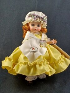 Madame Alexander doll in yellow dress