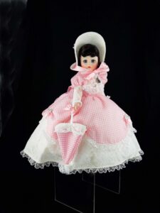 Madame Alexander doll in pink and white dress