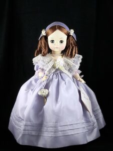 Madame Alexander doll Mimi in purple dress