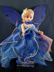 Madame Alexander doll in blue dress with fairy wings