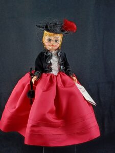 Madame Alexander doll in red and black dress