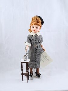 Lucy Ricardo doll in gray dress with Vitameatavegemin